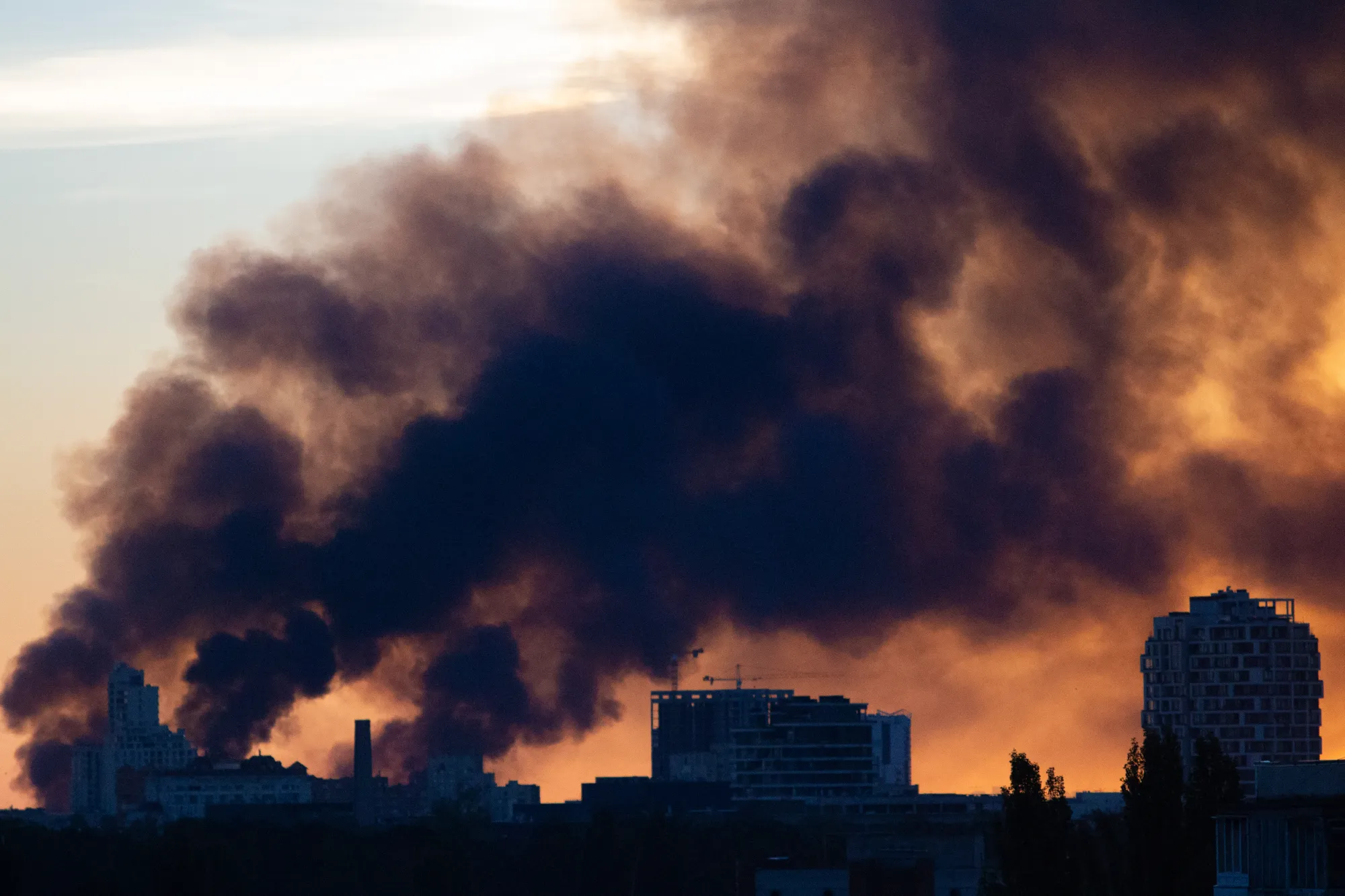 Residential buildings stand against the backdrop of smoke from a Russian attack on Kyiv. (Photo by Bohdan Diev/Global Images Ukraine via Getty Images) Tatyana Kudel’s’ka