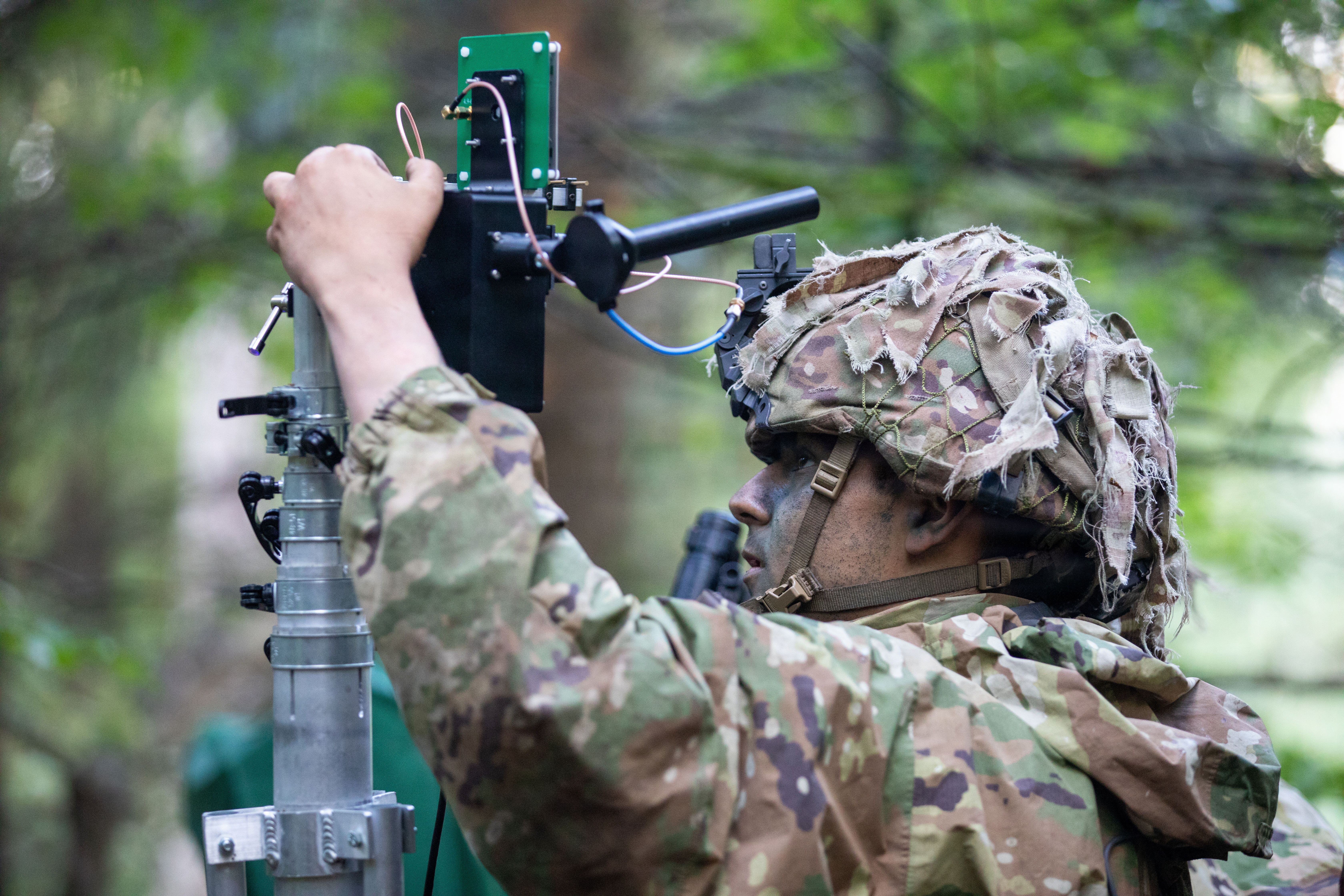 U.S. Army Pfc. Kristopher Pelroy, an air traffic control operator with 173rd Mobile Brigade Combat Team (Airborne), trains to counter unauthorized drones during exercise Saber Junction 26 at Joint Multinational Readiness Center's Hohenfels Training Area, Germany, Aug. 29, 2026. The ground control system utilized disables drones by jamming their navigation and control channels. During Saber Junction 26. (U.S. Army Photo by Sgt. Marc Morgenstern)
