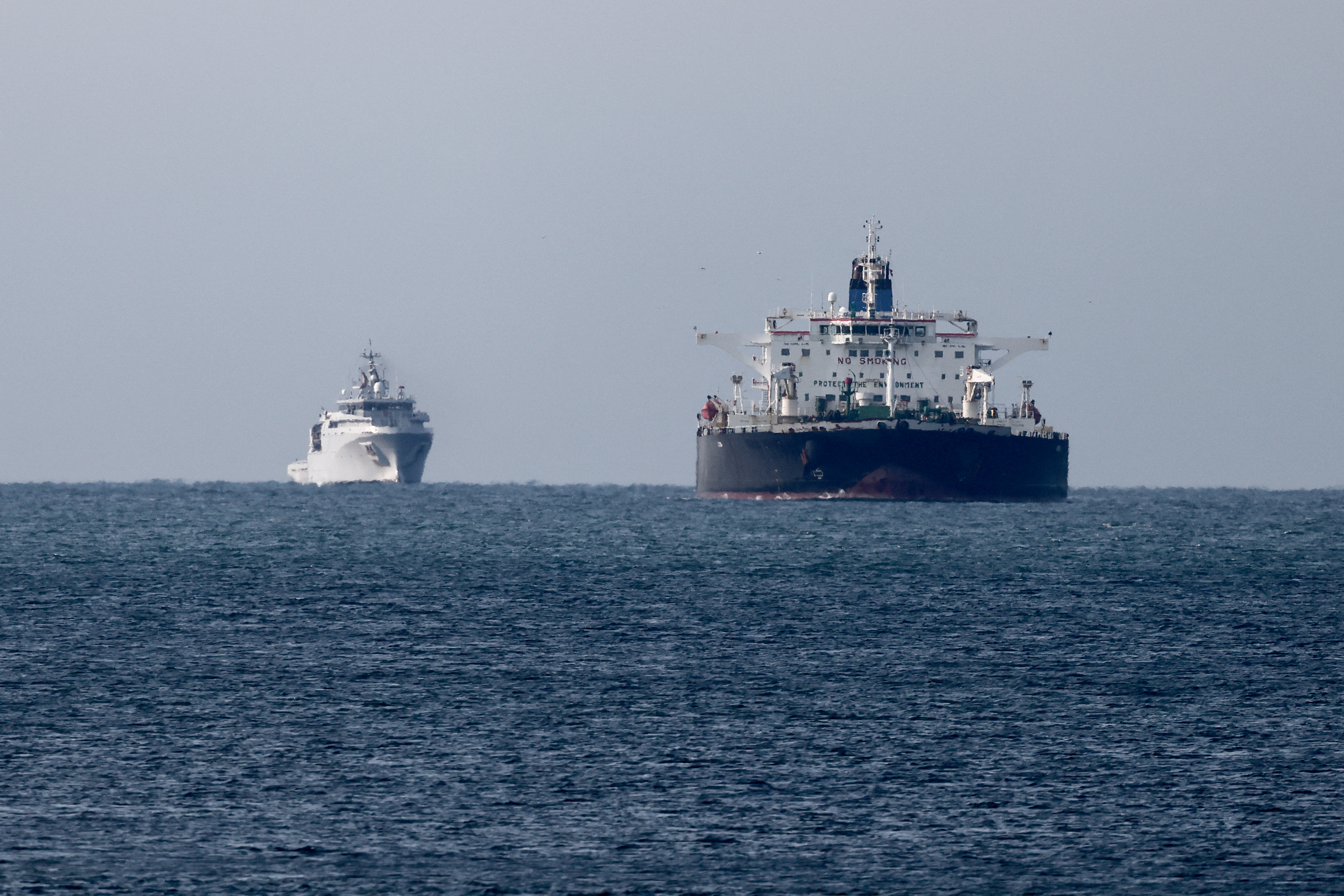 The Mozambican-flagged oil tanker "Deyna," suspected of belonging to Russia's shadow fleet, is seen outside the coast of Martigues near the port of Marseille-Fos on March 23, 2026, as it's surveilled by the French Navy. (Thibaud Moritz / AFP via Getty Images)
